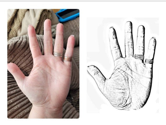 Stainless steel handprints necklace.