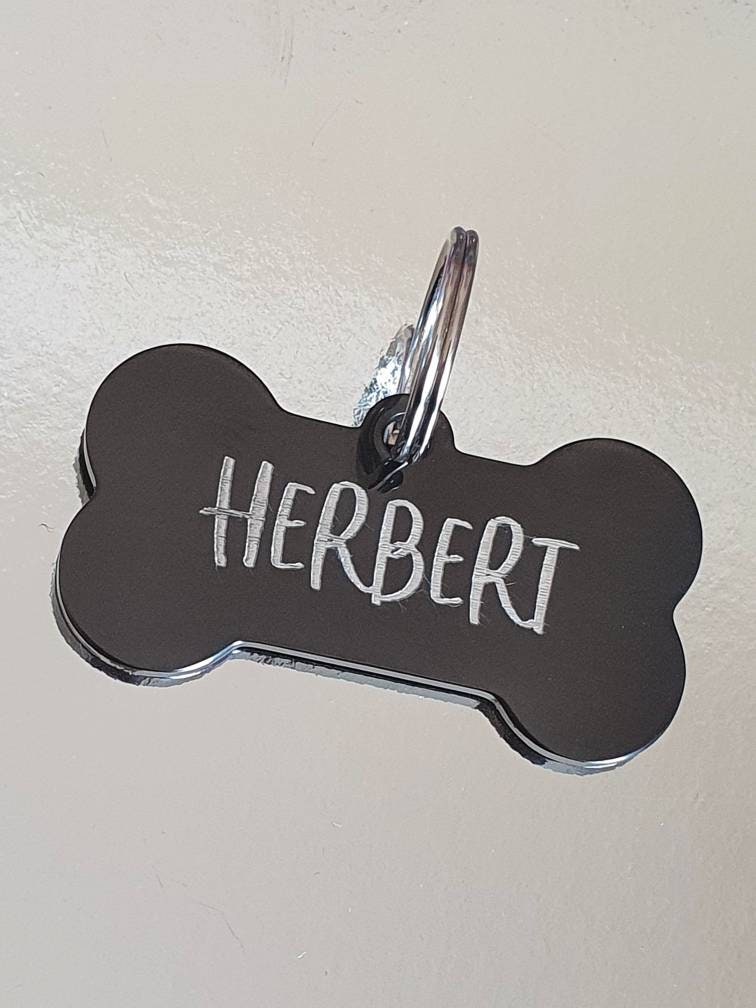 Dog ID tags, stainless steel black bones with silver showing through, various fonts to choose from