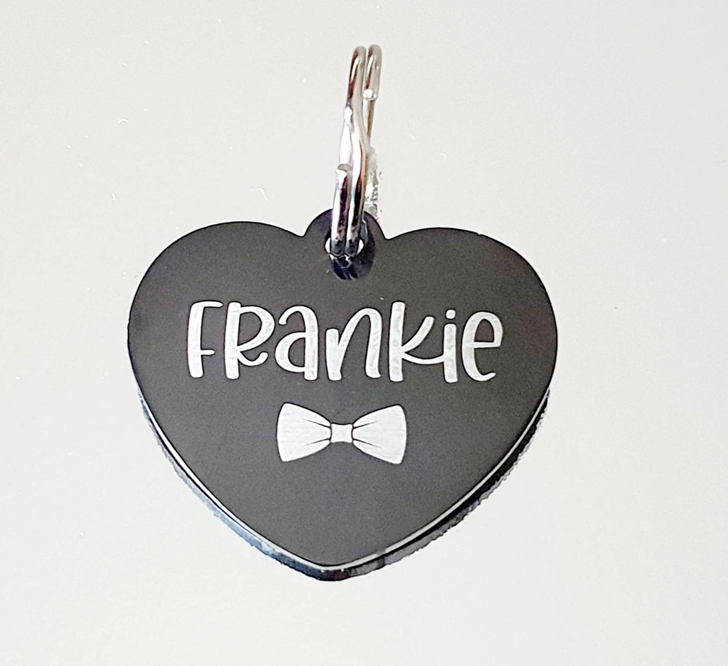 Bowtie design Black Stainless Steel heart pet ID tag.  Laser engraved.