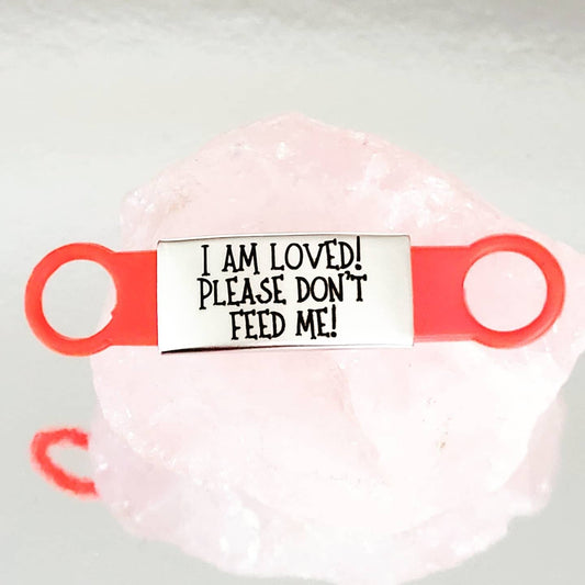 Please don't feed me! silicone and Steel pet ID tags, 2 sizes and 4 colours to choose from. Laser engraved. Cat tag
