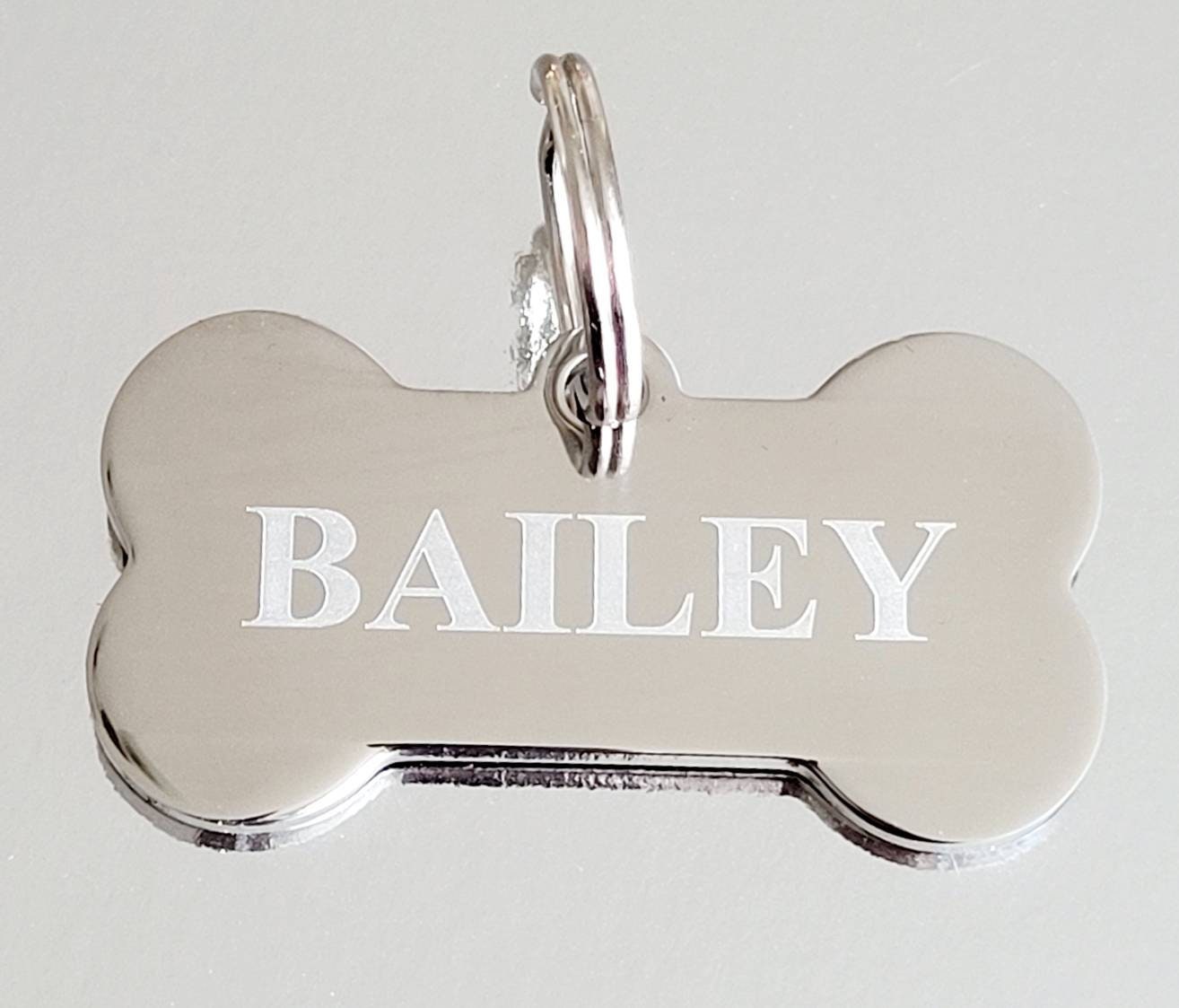 Bone pet tags laser engraved, available in silver, gold and rose gold.