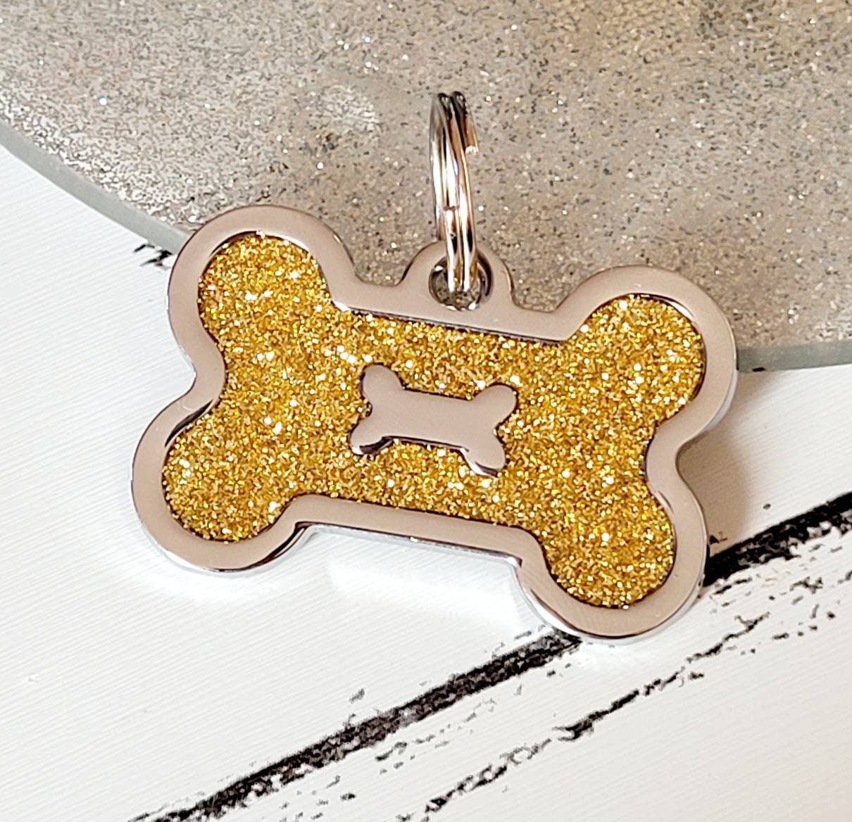 Quality coloured red sparkly bone dog ID tag, laser engraved.