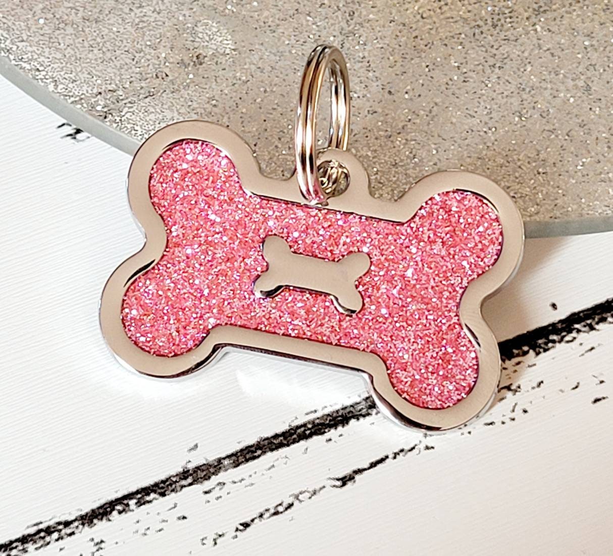 Quality coloured silver sparkly bone dog ID tag, laser engraved.