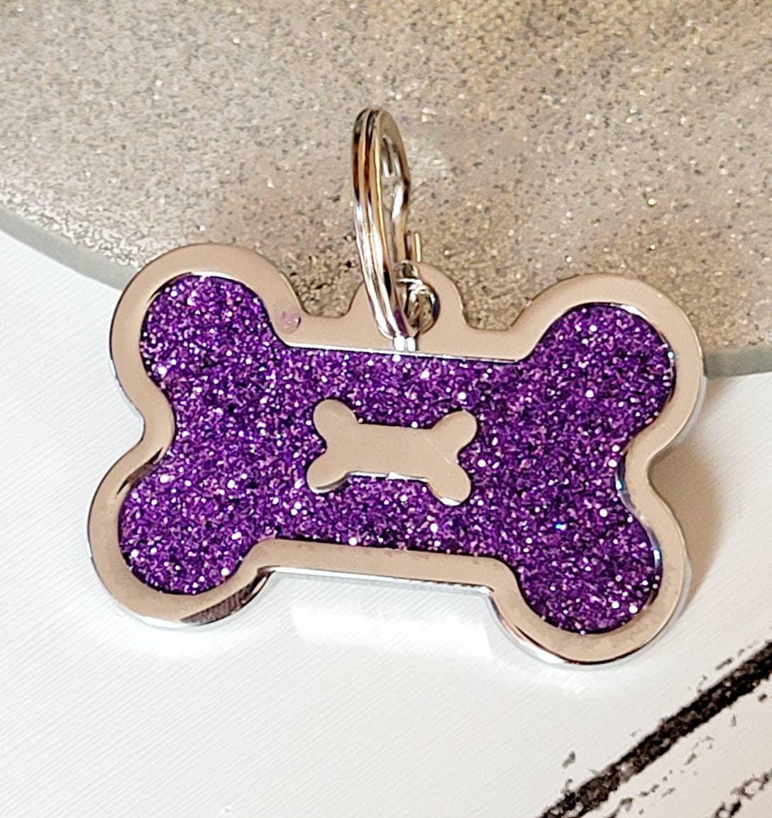 Quality coloured silver sparkly bone dog ID tag, laser engraved.