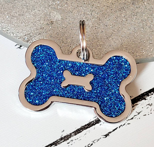Quality coloured blue sparkly bone dog ID tag, laser engraved.