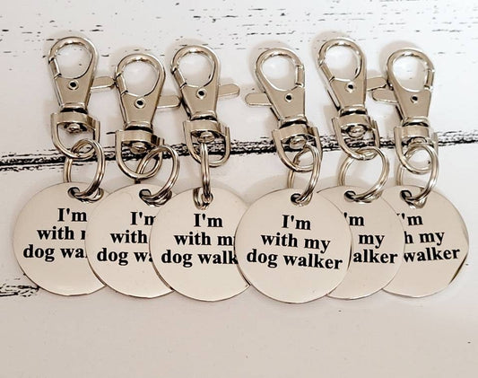 I'm with my dog walker, dog ID tag set. Set of identification tags.