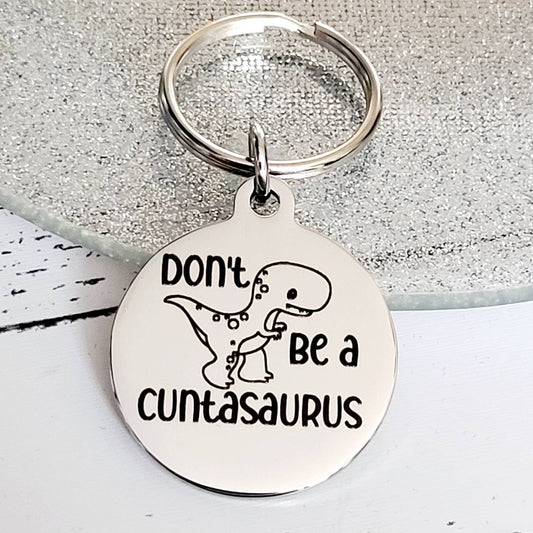 Don't be a Cuntasaurus. Profanity keyring.