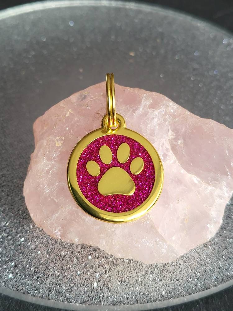 Quality gold coloured 25mm sparkly paw dog or cat ID tag, laser engraved.