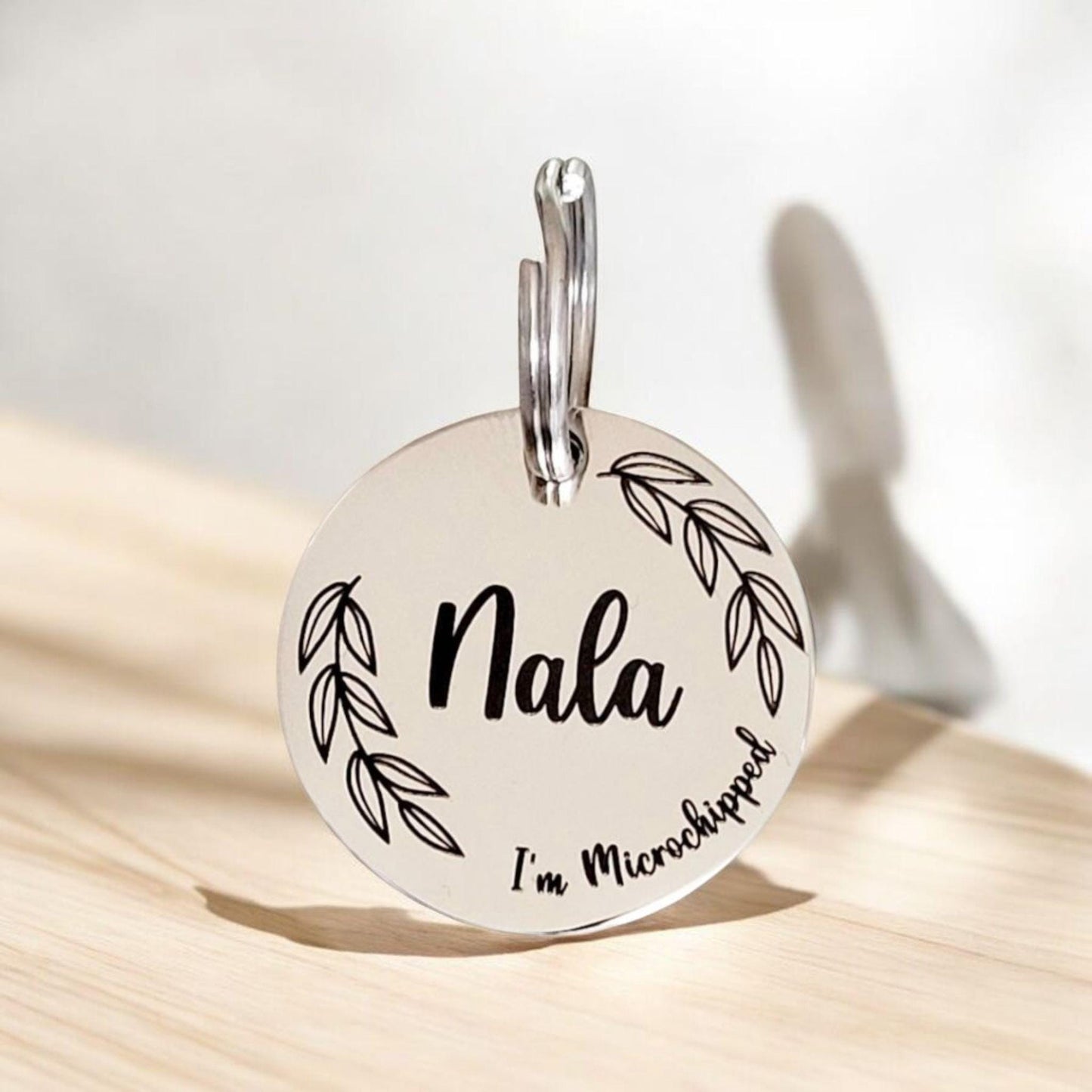 Beautiful stylish pet ID tag, with leafy border design. Available in silver, gold, rose gold or black stainless Steel