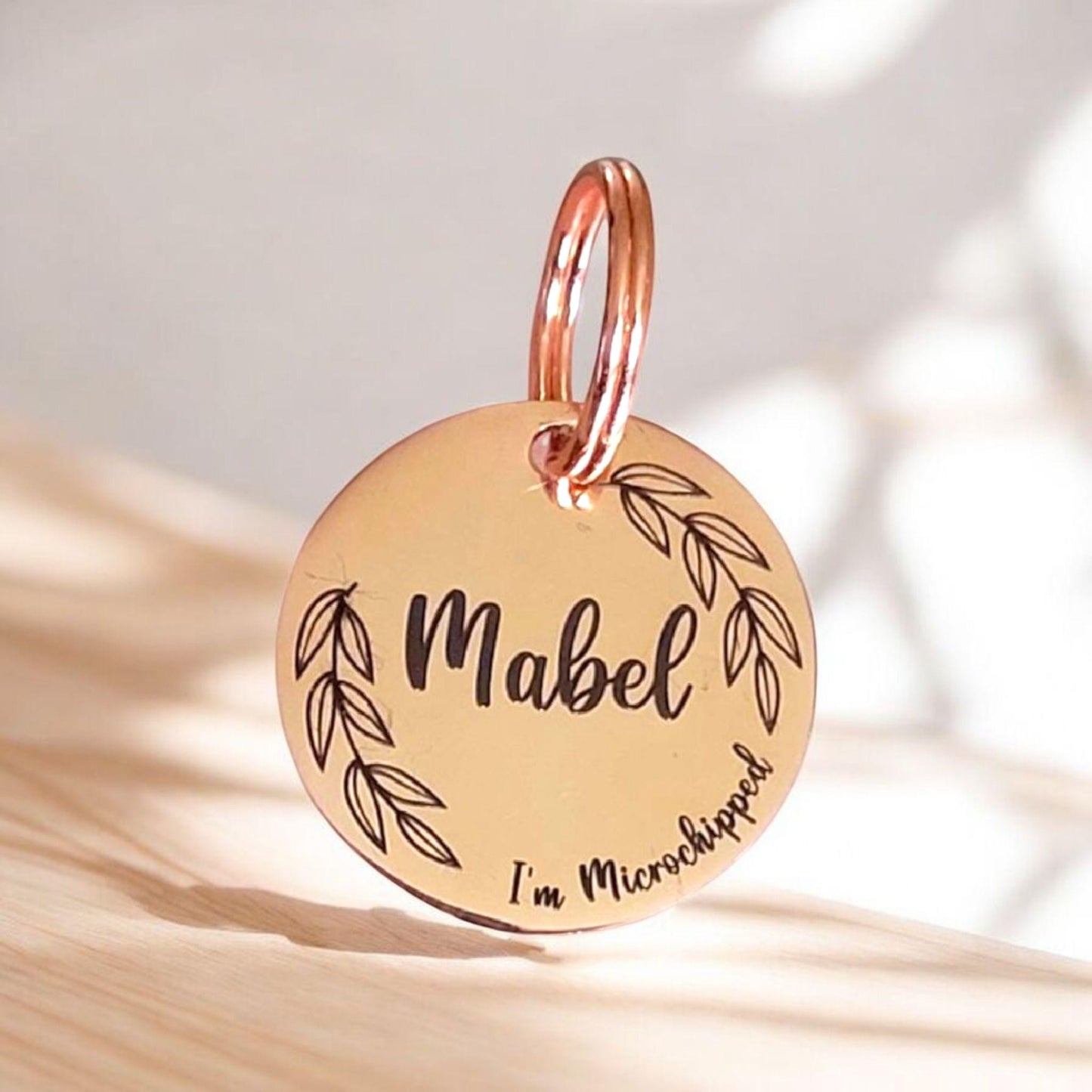 Beautiful stylish pet ID tag, with leafy border design. Available in silver, gold, rose gold or black stainless Steel