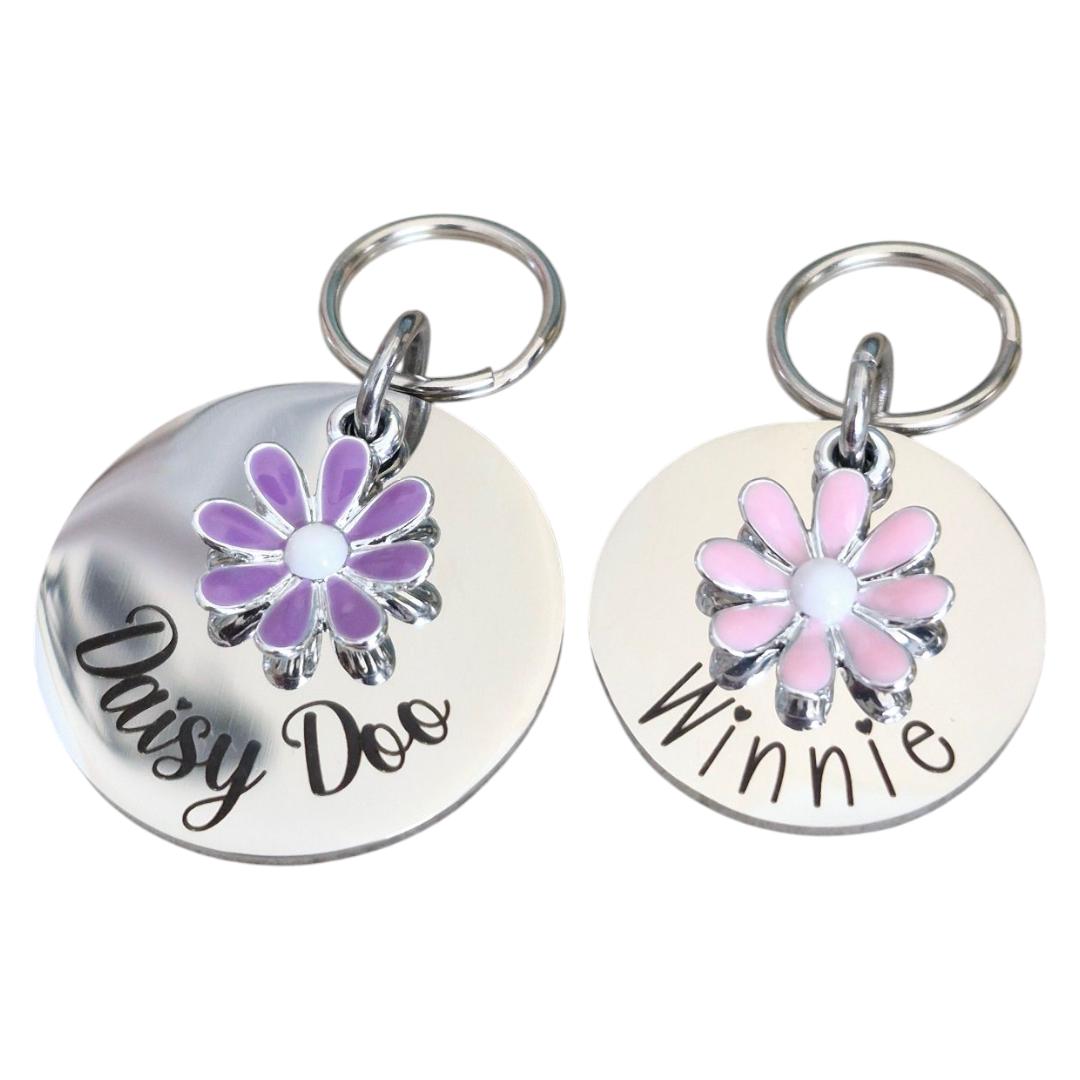 Silver pet ID tag with pink or lilac daisy charm. 25 or 30mm stainless steel.