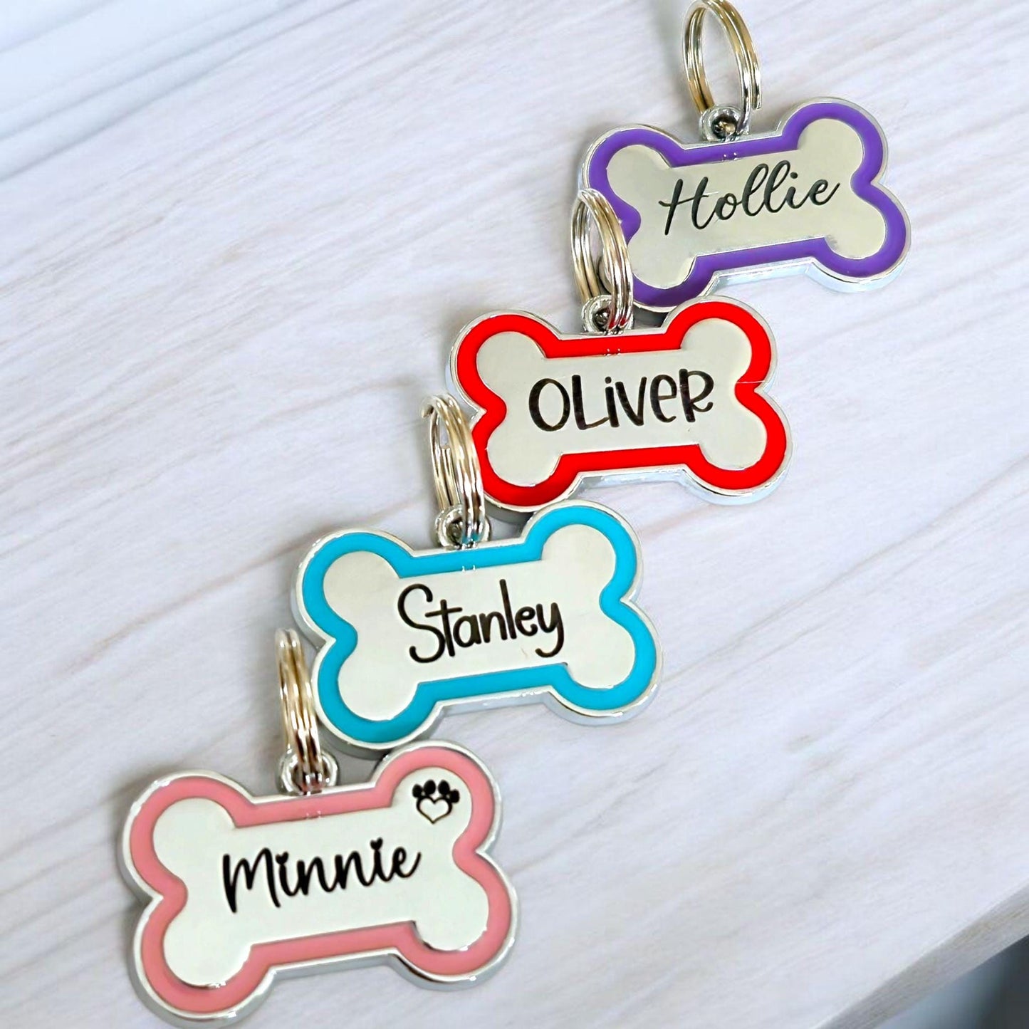 Alloy bone shaped dog ID tag, various colours and sizes.