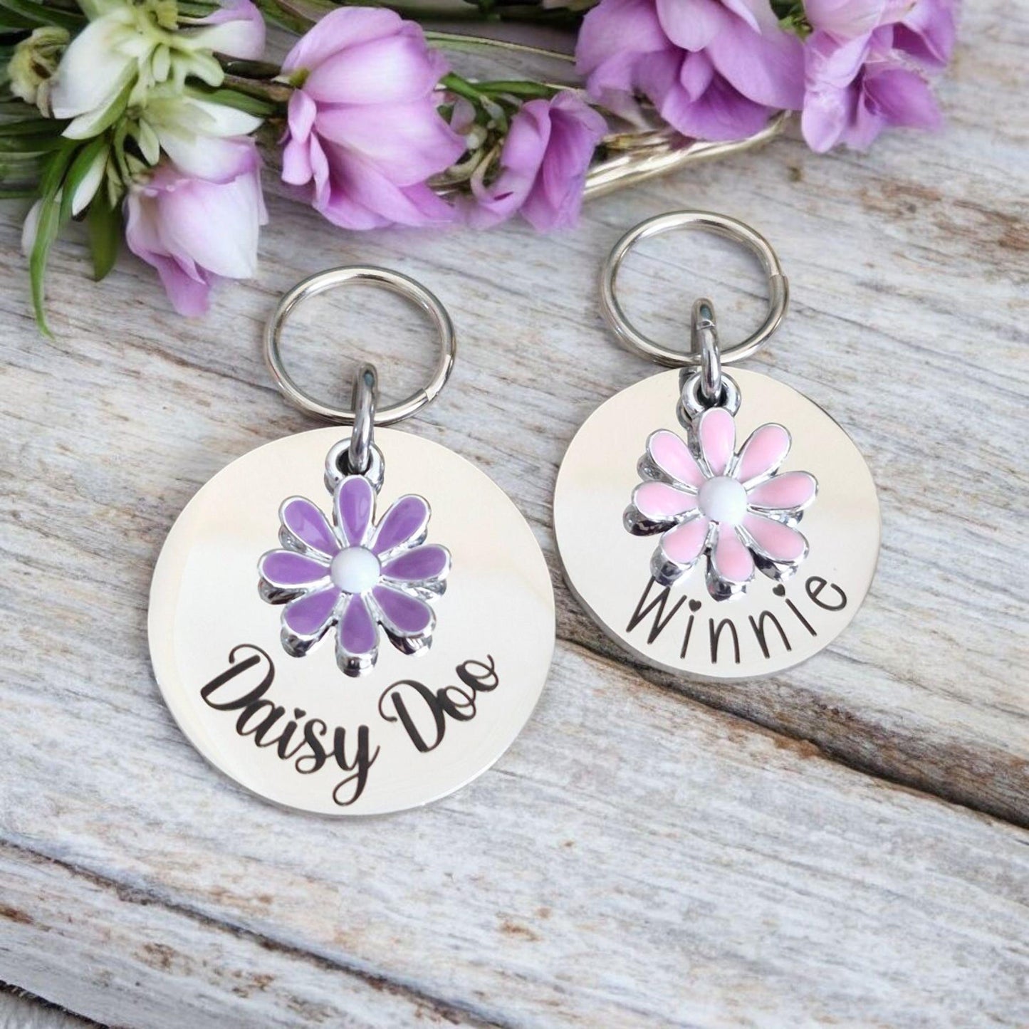 Silver pet ID tag with pink or lilac daisy charm. 25 or 30mm stainless steel.