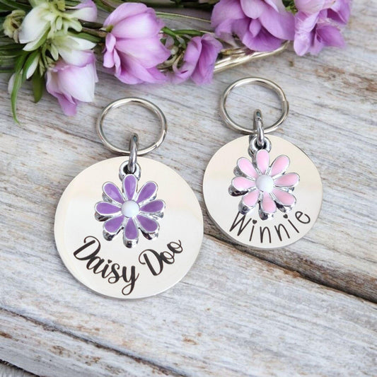 Silver pet ID tag with pink or lilac daisy charm. 25 or 30mm stainless steel.