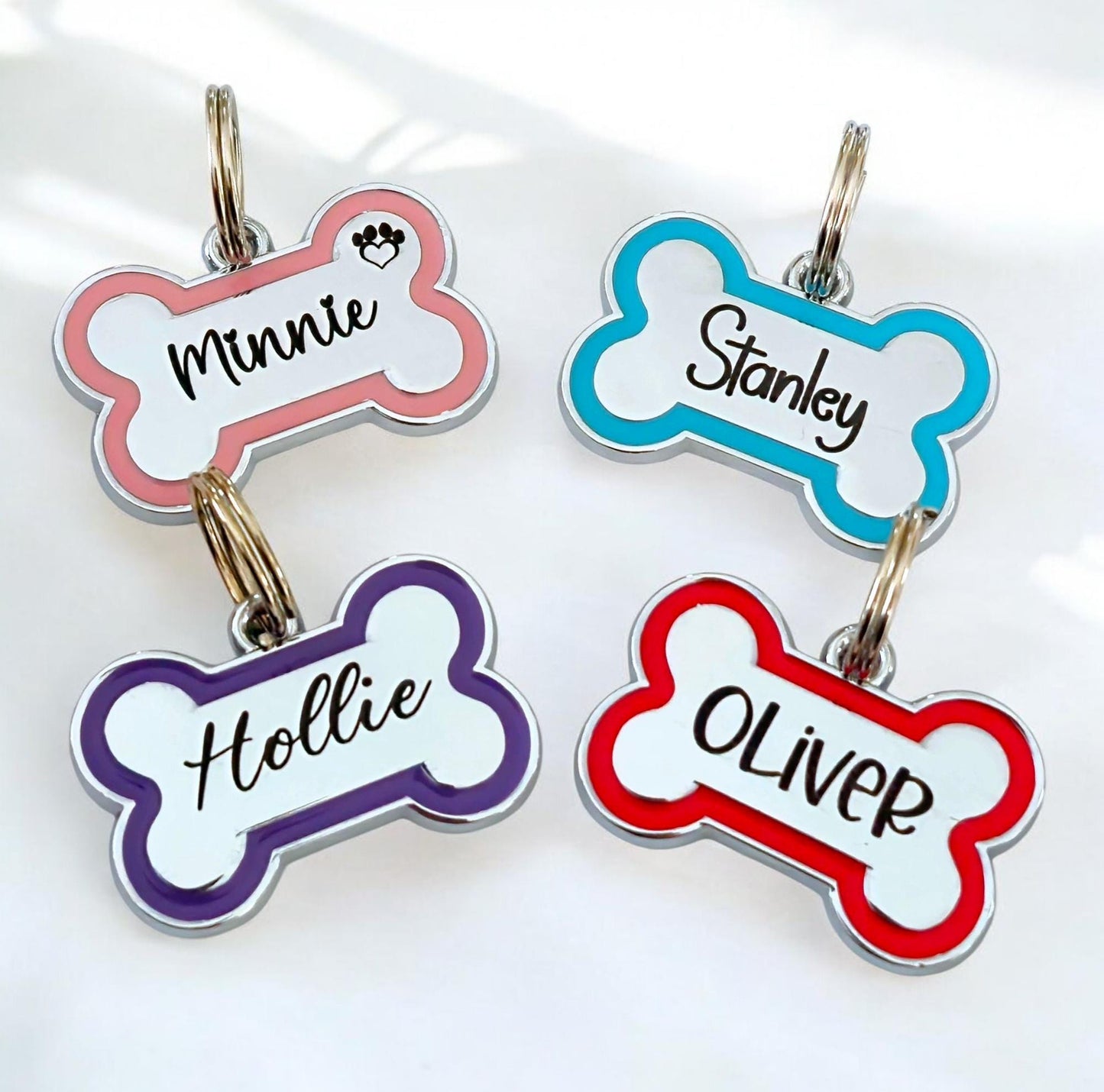Alloy bone shaped dog ID tag, various colours and sizes.