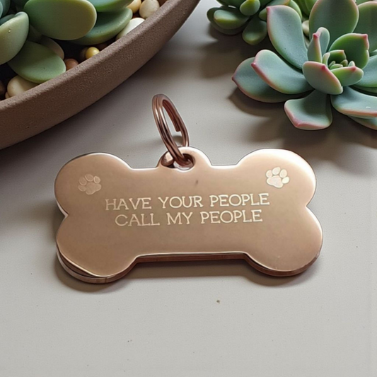 Bone shaped pet ID tag with paw design, 5 colours and 2 sizes to choose from.
