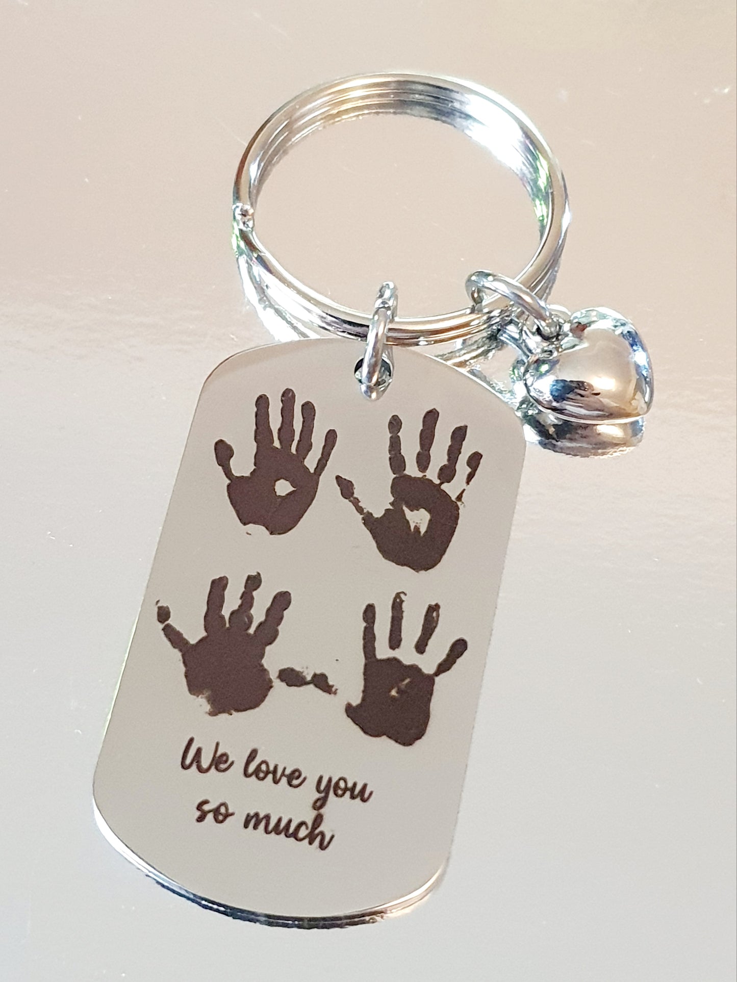 Handprint / footprint / fingerprint keyring.